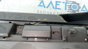 The Subaru Forester 25-26 trunk lid trim is broken, cracks, scratches, broken fasteners, a fragment is missing