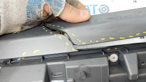 The Subaru Forester 25-26 trunk lid trim is broken, cracks, scratches, broken fasteners, a fragment is missing