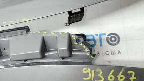 The Subaru Forester 25-26 trunk lid trim is broken, cracks, scratches, broken fasteners, a fragment is missing