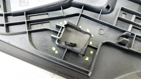 The Subaru Forester 25-26 trunk lid trim is broken, cracks, scratches, broken fasteners, a fragment is missing
