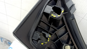 The Subaru Forester 25-26 trunk lid trim is broken, cracks, scratches, broken fasteners, a fragment is missing