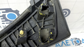 The Subaru Forester 25-26 trunk lid trim is broken, cracks, scratches, broken fasteners, a fragment is missing
