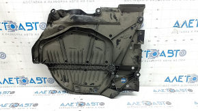 The left fuel tank guard for a Subaru Forester 25-26 is dented and torn.