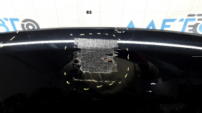 The hood of a Ford Explorer 20-25 is bare, black, UM, and has chips and glue on it.
