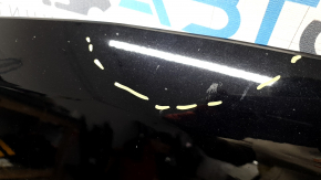 The hood of a Ford Explorer 20-25 is bare, black, UM, and has chips and glue on it.
