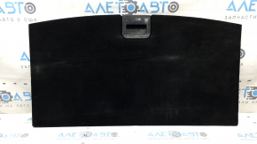 The trunk floor of a Ford Explorer 20-25 is black, worn, scratches on the handle, and a tear.