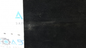 The trunk floor of a Ford Explorer 20-25 is black, worn, scratches on the handle, and a tear.