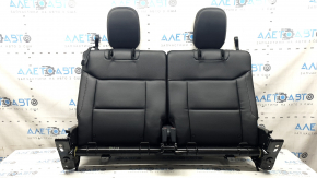 The back of the rear row of seats, row 3, Ford Explorer 20-25, black leather, with headrests, scuffs