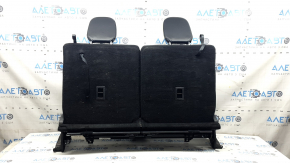 The back of the rear row of seats, row 3, Ford Explorer 20-25, black leather, with headrests, scuffs