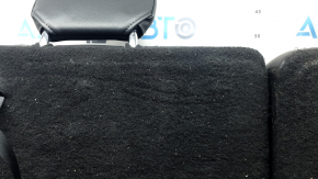 The back of the rear row of seats, row 3, Ford Explorer 20-25, black leather, with headrests, scuffs