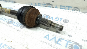 The front left half shaft of a Ford Explorer 20-25 AWD is rusty, and the outer CV joint boot is torn.