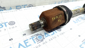 The front left half shaft of a Ford Explorer 20-25 AWD is rusty, and the outer CV joint boot is torn.