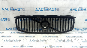 Radiator grill with Volvo XC60 18-21 badge under the camera, sand, broken fasteners