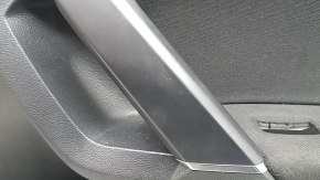 Black front right door panel for a VW Tiguan 18-20, with a buzzer, black fabric armrest, fabric insert, black chrome insert, with a handle, scratches, peeling handle cover, needs cleaning, dent
