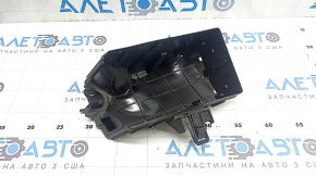 The underhood fuse box housing for a VW Tiguan 18-24 has a broken mount.