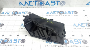 The underhood fuse box housing for a VW Tiguan 18-24 has a broken mount.