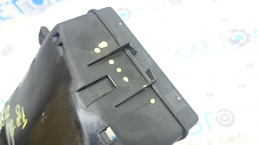 The underhood fuse box housing for a VW Tiguan 18-24 has a broken mount.