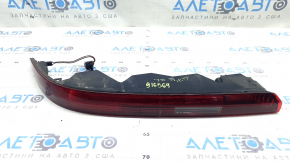 The left rear bumper light of the Audi Q7 16-26 is worn.