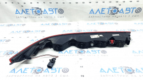 The left rear bumper light of the Audi Q7 16-26 is worn.