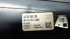 The left rear bumper light of the Audi Q7 16-26 is worn.