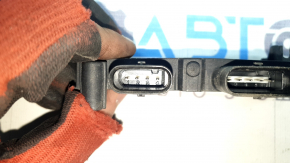 The foot-operated trunk lid opening sensor assembly for the Audi Q7 16-26 has a broken mount.
