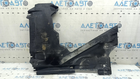 The rear right underbody protection of the Audi A5 F5 18-25 is pressed, worn, and cracked.