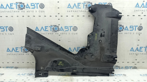 The rear right underbody protection of the Audi A5 F5 18-25 is pressed, worn, and cracked.