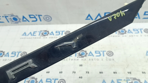 The trunk lid molding for a Toyota Camry v70 18-24 is missing an emblem fragment.