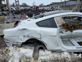 Rear right quarter wing of a Ford Mustang mk6 15-23 coupe, on the body, white, dents