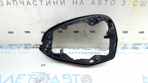 The right mirror housing of the Audi A5 F5 18-25 is dented.