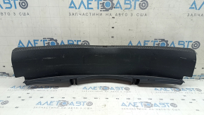 The Audi A4 B9 17-20 trunk opening trim is black, worn, and the mount is broken.
