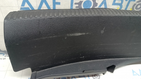 The Audi A4 B9 17-20 trunk opening trim is black, worn, and the mount is broken.