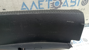 The Audi A4 B9 17-20 trunk opening trim is black, worn, and the mount is broken.