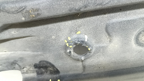 The left underbody protection of a Toyota Camry v70 18-24 is dented and torn.
