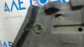 The left underbody protection of a Toyota Camry v70 18-24 is dented and torn.