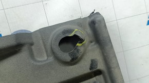 The left underbody protection of a Toyota Camry v70 18-24 is dented and torn.