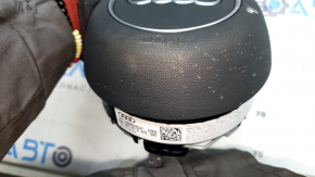 The Audi A4 B9 17-25 gray steering wheel airbag has a broken mount.