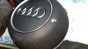 The Audi A4 B9 17-25 gray steering wheel airbag has a broken mount.