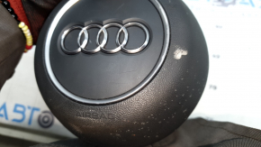 The Audi A4 B9 17-25 gray steering wheel airbag has a broken mount.