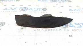 The right front bumper mudguard of an Audi A4 B9 17-25 is worn and scratched.