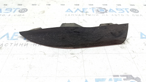 The left front bumper mudguard of an Audi A4 B9 17-25 is worn and scratched.