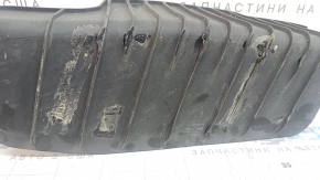 The lower control arm lining under the rear left spring is dented for an Audi A4 B9 17-25.