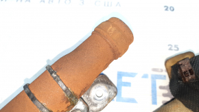 The left side curtain airbag of a BMW 3 G20 19-26 is covered in soot and has a rusty squib.