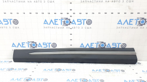 The lower front left door trim for a Lincoln Corsair 20-26 is dented and torn.