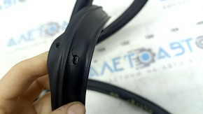 The rear right door seal of the Lincoln Corsair 20-26 is torn.