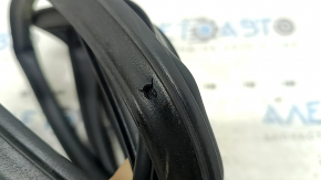 The rear right door seal of the Lincoln Corsair 20-26 is torn.