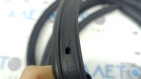 The front right door seal of the Lincoln Corsair 20-26 is torn.