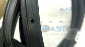 The front right door seal of the Lincoln Corsair 20-26 is torn.