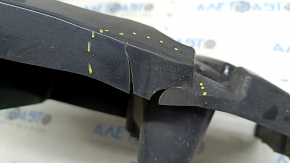 The lower right rear bumper mount on a BMW X3 F25 15-17 is cracked.