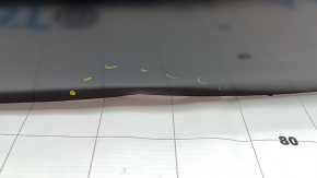 The trunk door of a Toyota Venza 21-24 is dented.